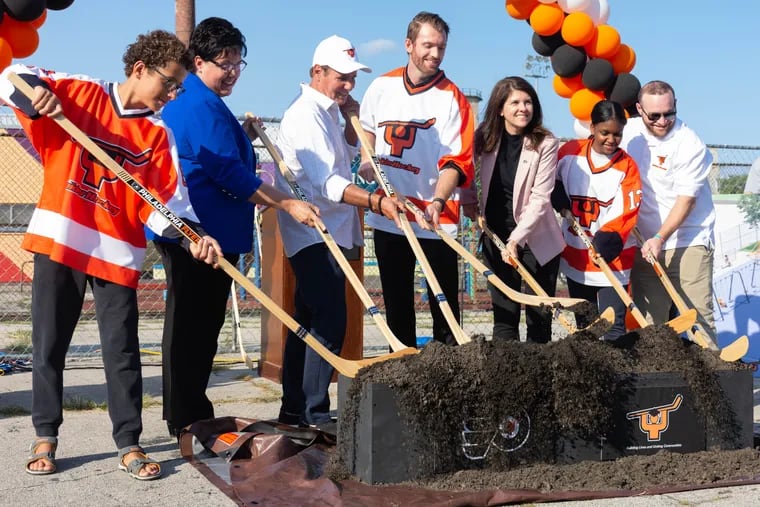 Members of Snider Youth Hockey, as well as speakers Kathryn Ott Lovell, Scott Tharp, Valerie Camillo, and Sean Couturier, break ground on a new ball hockey rink in Kensington.