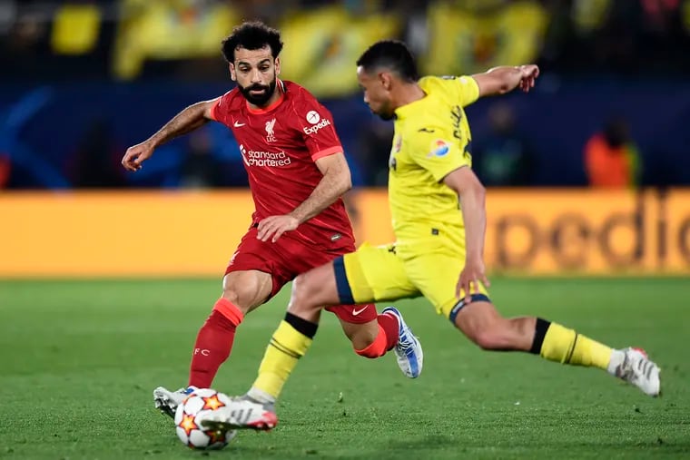 Liverpool's Mohamed Salah (left) dueling with Villarreal's Francis Coquelin during Tuesday's Champions League semifinal game in Spain.