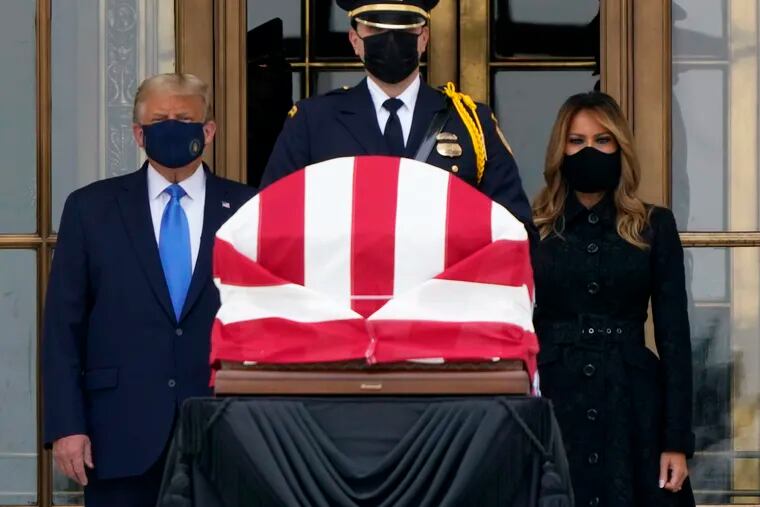 President Donald Trump and first lady Melania Trump pay respects as Justice Ruth Bader Ginsburg lies in repose at the Supreme Court building on Thursday.