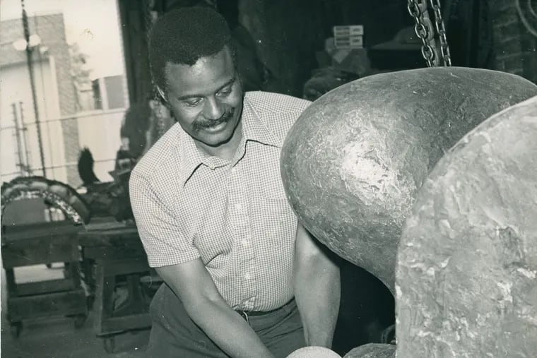 The sculptor John Rhoden working on "Nesaika," his sculpture for the African American Museum in Philadelphia, in the studio.