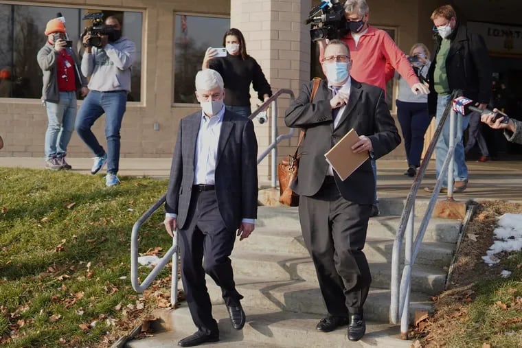 Former Michigan Gov. Rick Snyder exits after video arraignment at the Genesee County Jail in Flint, Mich., on Jan. 14, 2021, on new Flint Water Crisis charges.