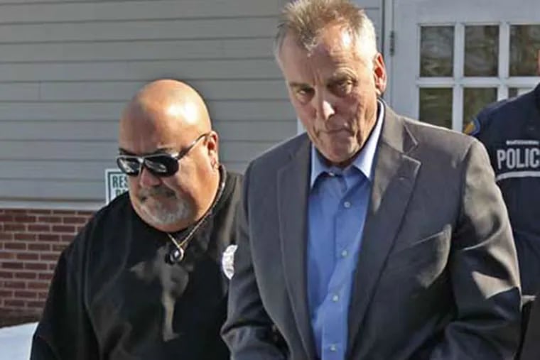 In the March file photo, Don Tollefson, in handcuffs, center, is escorted out of District Court in Warminster by two Pennsylvania State Constables. (MICHAEL BRYANT, File / Staff Photographer)