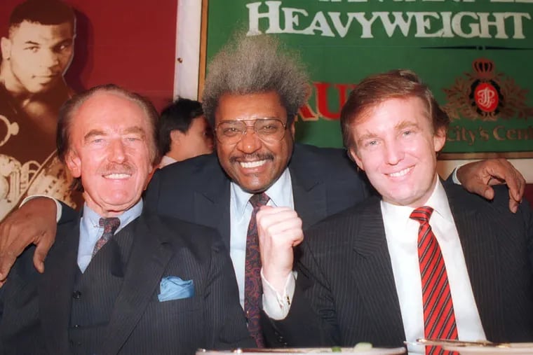 (From left to right) Fred Trump, boxing promoter Don King and Donald Trump participate in a 1987 news conference in Atlantic City, N.J.