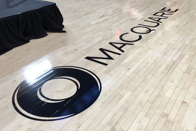 A Macquarie logo on the floor of the Palestra. Penn sold the naming rights to the court, which is now officially known as "Macquarie Court at the Palestra."