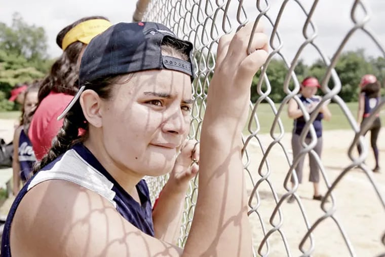 Camden Angels player Nini Torres watches the action during a game against Urban Sporst Zone at the 10th Street park on July 18, 2015. ( ELIZABETH ROBERTSON / Staff Photographer )