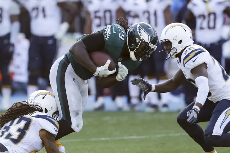 Eagles running back LeGarrette Blount (29) powers through Los Angeles Chargers defenders in the fourth quarter.