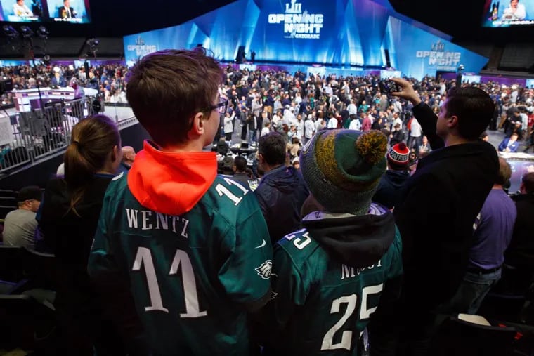 Brothers and Eagles fans Eli Meltzer, left, and Noah Meltzer, right, watch from the stands at Super Bowl Media Night, at the Xcel Energy Center, in St. Paul, Minnesota, Monday, Jan. 29, 2018.