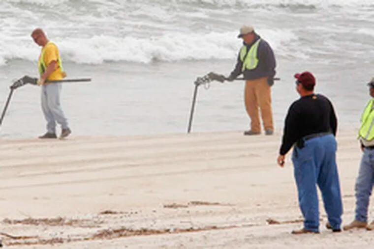 The beaches are closed in Surf City, N.J., while a crew searches for unexploded ordnance that a beach-replenishment project brought ashore. Officials say they believe the rusty munitions were dumped offshore decades ago and then sucked up by a dredge.