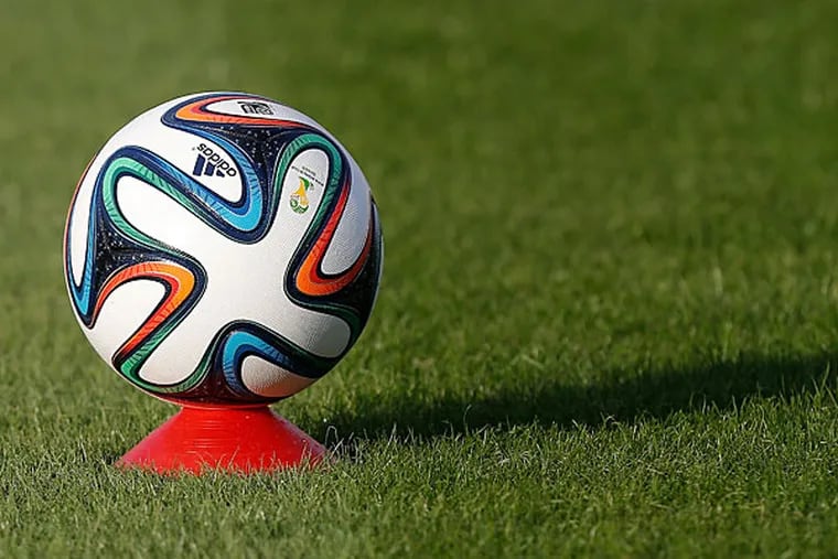 A Brazuca, the official soccer ball of the 2014 World Cup, sits on a cone, during a training session at the Santa Cruz Stadium in Ribeirao Preto, Brazil, Tuesday, June 10, 2014. (David Vincent/AP)