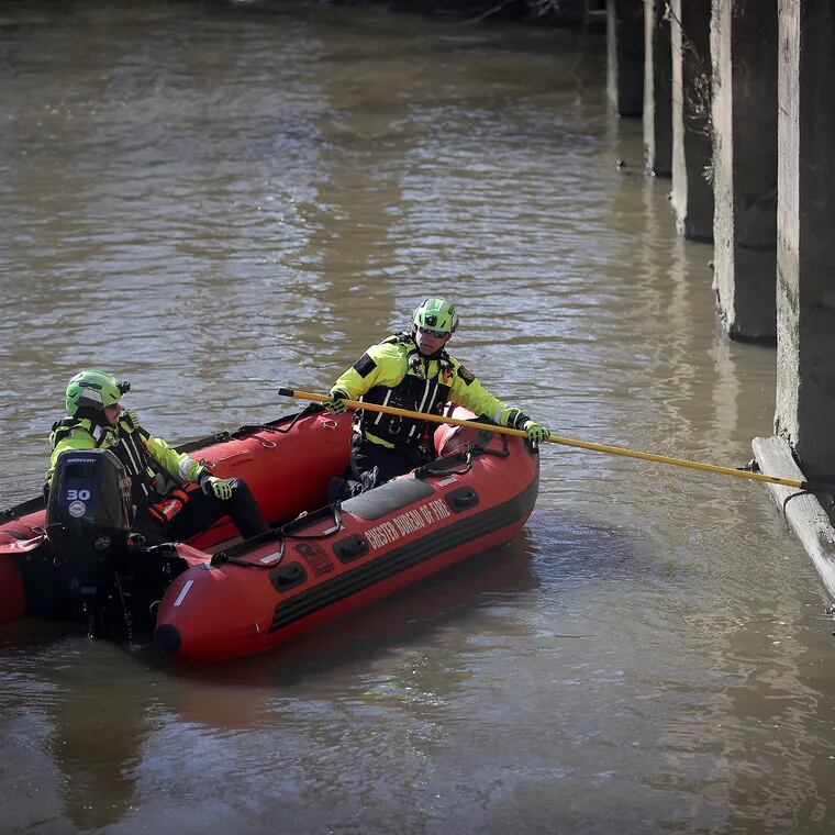 An emergency response crew from the Chester Bureau of Fire search for a missing 6-year-old girl in Chester Creek near 5th Street in Chester, Pa. on Sunday, March 24, 2024.