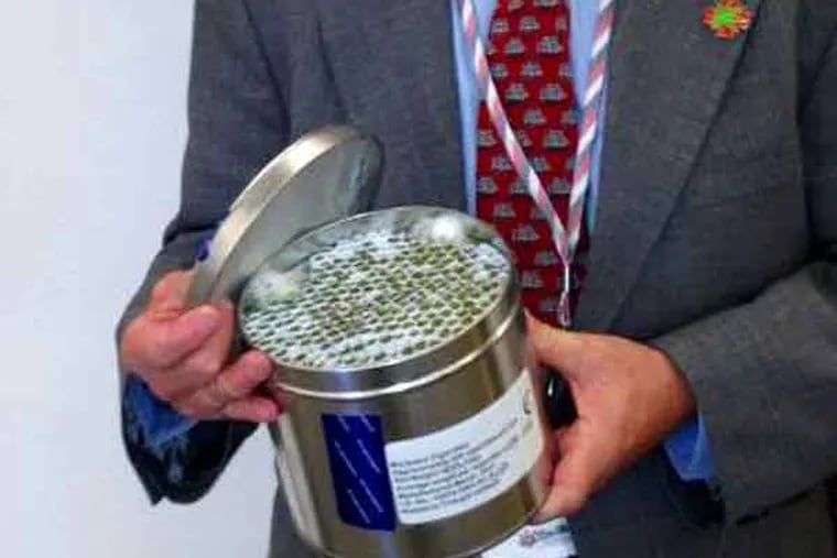 Medical marijuana patient Irvin Rosenfeld in Washington DC, 6/17/13, holding his tin of 300 marijuana cigarettes provided every month to him by the federal government.