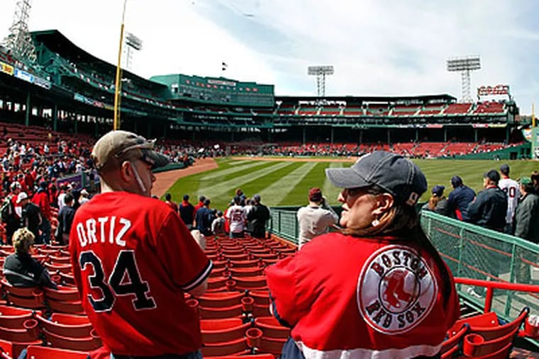 Boston fans have become spoiled by the championships won by all four of their major professional teams. (Elise Amendola/AP)