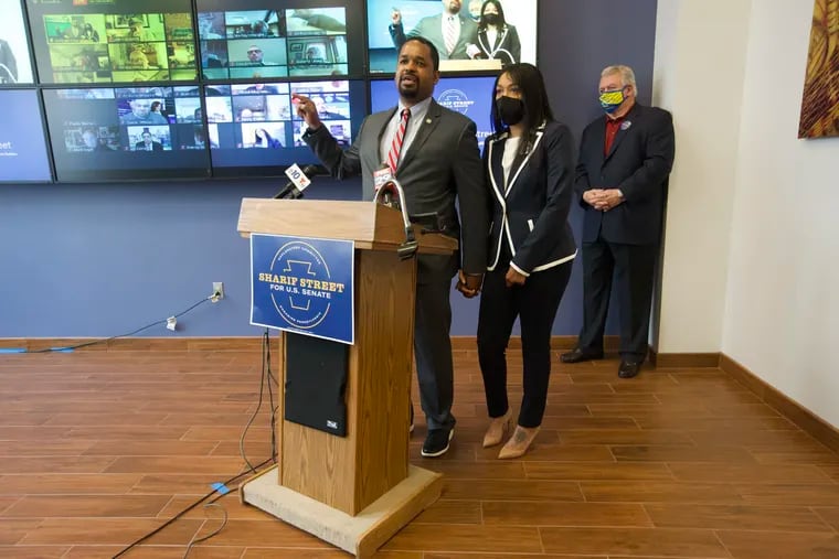 Pennsylvania State Sen. Sharif Street (D., Philadelphia), with his wife, April, and Philadelphia Democratic Party chair Bob Brady, announces his exploratory committee for U.S. Senate on Friday at the Labor District Council building in Philadelphia.