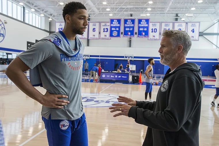 Jahlil Okafor and Sixers head coach Brett Brown talk after practice.