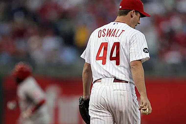 Roy Oswalt allowed four runs, three earned, in five innings during Game 2 of the NLDS. (Yong Kim/Staff Photographer)
