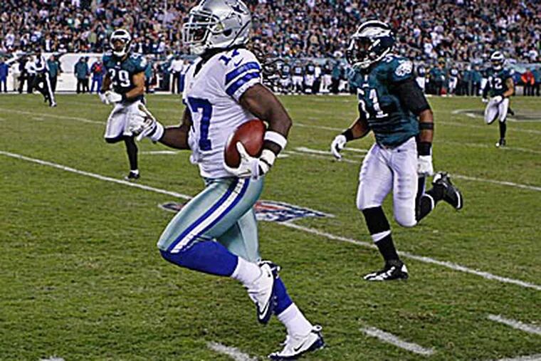 Cowboys punt returner Dwayne Harris runs down the sideline on his touchdown. (Ron Cortes/Staff Photographer)