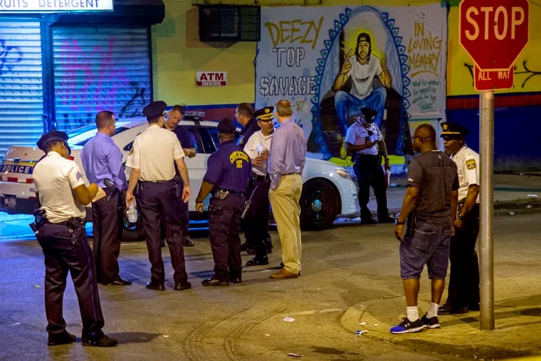 The scene at 12th and Huntingdon Streets late Wednesday night where at least six people were wounded – two fatally – in a drive-by shooting.