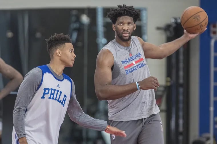 Joel Embiid plays keep-away from first-round draft pick Markelle Fultz.
