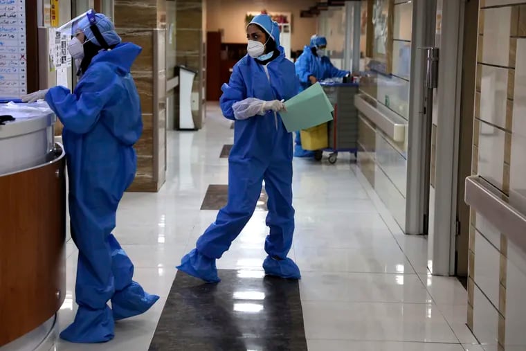 Nurses work in a COVID-19 ward of the Shohadaye Tajrish Hospital in Tehran, Iran. After months of fighting the coronavirus, Iran only just saw its highest single-day spike in reported cases after Eid al-Fitr, the holiday that celebrates the end of Ramadan.