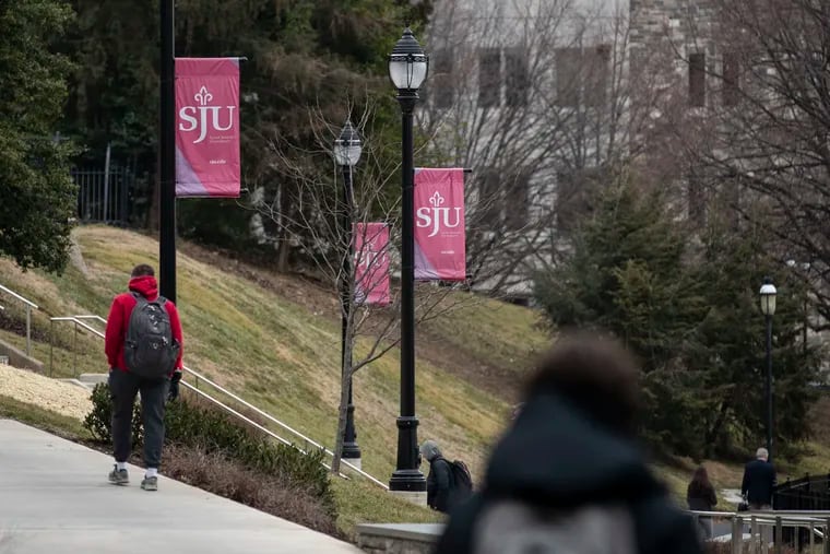 Students walk on campus at St. Joseph’s University in Philadelphia.