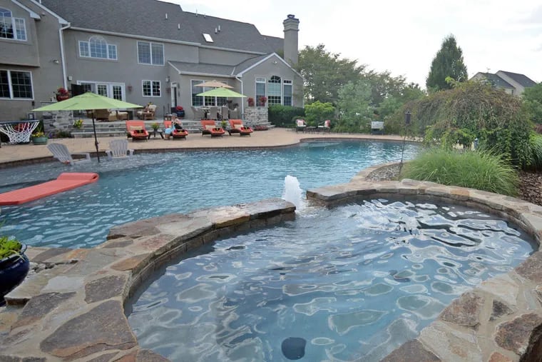 The backyard pool at Sharon and Armen DiFilippo’s house in Schwenksville, where they have put their own flourishes.