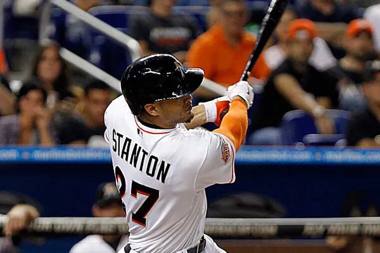 What owner Jeffrey Loria did in the span of 12 months was so ridiculous that it would be surprising if anyone showed up at Marlins Park this season to see Giancarlo Stanton. (Alan Diaz/AP file photo)