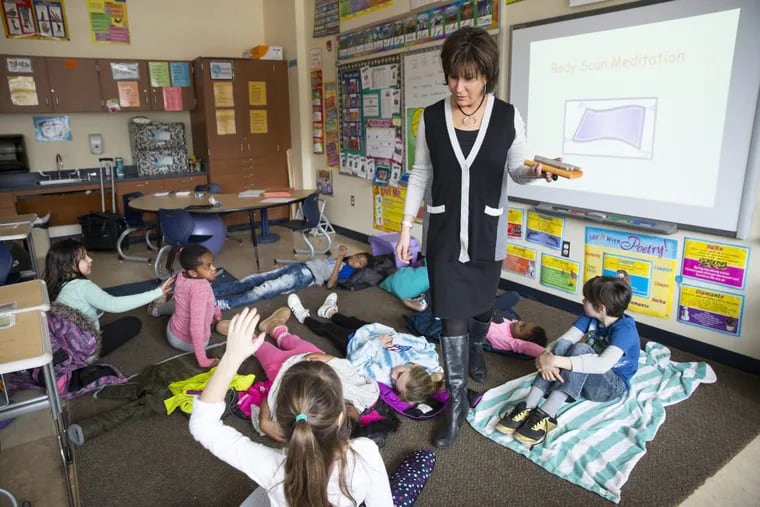 Cindy Goldberg, a mindfulness and positive psychology coach, leads a third- grade class in mindfulness training, at Glenside Elementary, in Glenside, PA, Tuesday, Feb. 6, 2018.  JESSICA GRIFFIN / Staff Photographer.