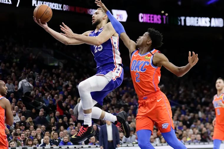 Sixers guard Ben Simmons drives to the basket past Thunder guard Shai Gilgeous-Alexander on Monday.