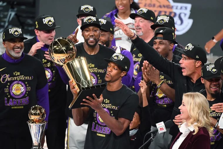 The Lakers' Rajon Rondo takes the trophy after the Lakers defeated the Miami Heat to win the NBA Championship in Game 6 of the NBA Finals. He would be a great addition for the 76ers.