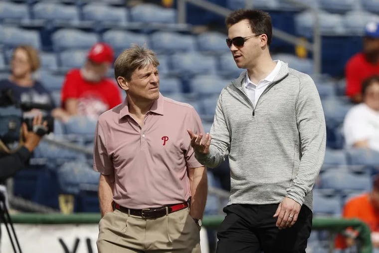 Assuming the Phillies don’t fade from playoff contention, general manager Matt Klentak, right, and owner John S. Middleton will have to decide how aggressively to pursue adding players before the July 31 trade deadline.