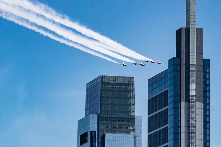 The Airforce Thunderbirds fly by the two Comcast Towers in Philadelphia in April 2020.