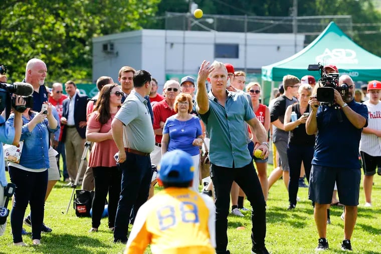 Former Phillies second baseman Chase Utley tosses a ball during a baseball clinic for the Allentown West End Gators at the refurbished Union Terrace Elementary School youth baseball field in Allentown.