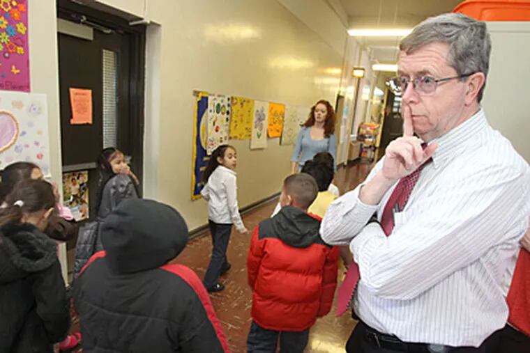 Principal James Otto gestures for students to proceed quietly to lunch at Sheppard Elementary. CHARLES FOX / Staff Photographer