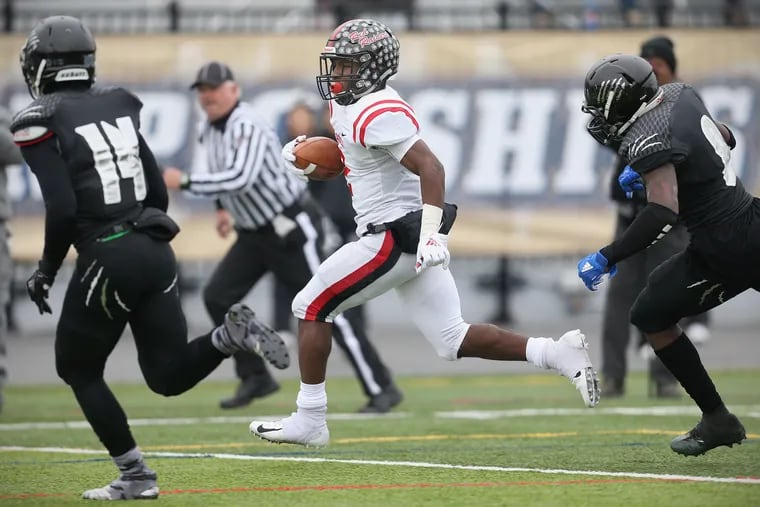 Coatesville's Dapree Bryant (2) here running for a touchdown in last season's PIAA Class 6A semifinal game against Harrisburg, enters Friday night's game vs. Unionville with 42 career touchdown catches. The Southeastern Pennsylvania record s 43, set 47 years ago.