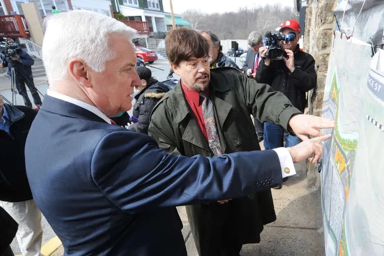 Millbourne Mayor Thomas Kramer (center) welcomes Gov. Corbett to his tiny Delaware County borough, which the state declared &quot;financially distressed&quot; in 1993.