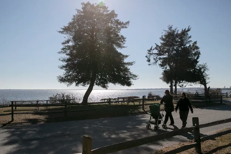 People walk around John F. Kennedy Park in Somers Point on Wednesday when the weather made a run at spring. Don't get used to it.