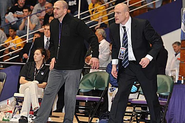 Penn State head coach Cael Sanderson (right) leads a team that could challenge for a national title.
