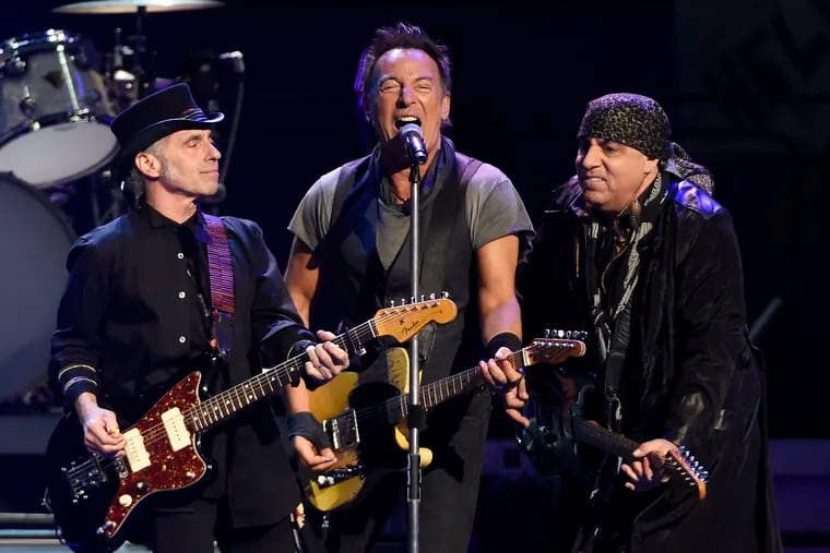FILE - In this March 15, 2016 file photo, Bruce Springsteen, center, performs with Nils Lofgren, left, and Steven Van Zandt of the E Street Band during their concert at the Los Angeles Sports Arena in Los Angeles. Springsteen will release a new rock album he recorded live in his New Jersey home studio with the E Street Band. The Boss said Thursday, Sept. 10, 2020, the album is called “Letter to You” and he and the band recorded it in just five days. It will be released on Oct. 23. (Photo by Chris Pizzello/Invision/AP, File)