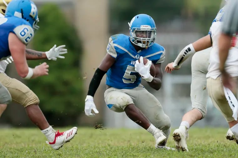 Bensalem’s Jalen Smith looks for running room in the second half of the Owls' 16-13 win over Frankford on Friday.