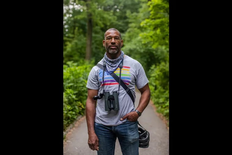 Christian Cooper poses for a portrait in Central Park on Wednesday.
