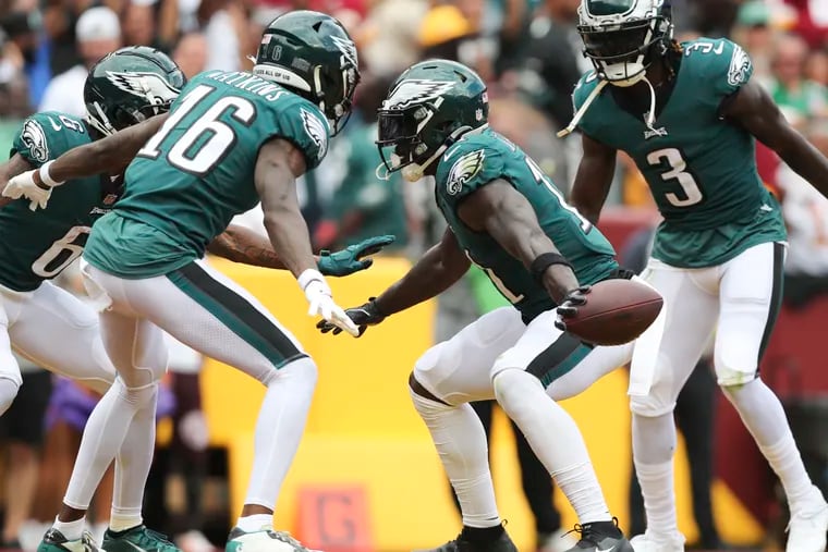 Eagles wide receiver A.J. Brown celebrates his second-quarter touchdown catch with his teammates against the Washington Commanders at FedExField in Landover, MD on Sunday, September 25, 2022.