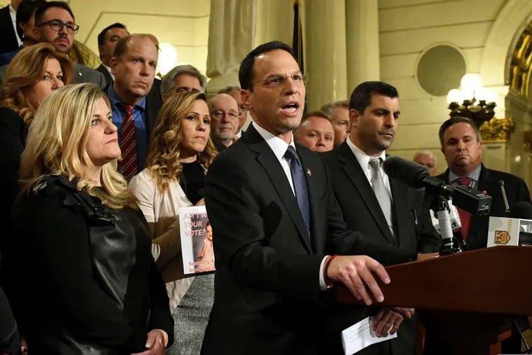 Attorney General Josh Shapiro of Pennsylvania speaks at a news conference in the state Capitol after legislation to respond to a landmark grand jury report accusing hundreds of Roman Catholic priests of sexually abusing children over decades stalled in the Legislature, Wednesday, Oct. 17, 2018 in Harrisburg, Pa. Shapiro is flanked by lawmakers and victims of child sexual abuse.