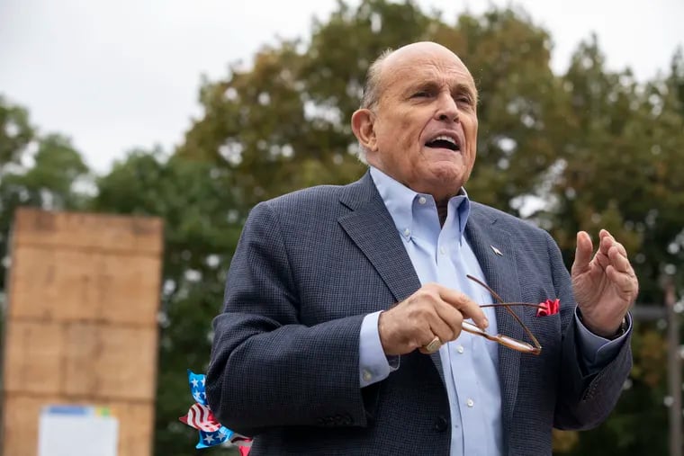 Former Mayor of New York City, Rudy Giuliani made a visit to the boxed Columbus statue at Marconi Plaza in Philadelphia, Pa. on Monday, October 12, 2020.