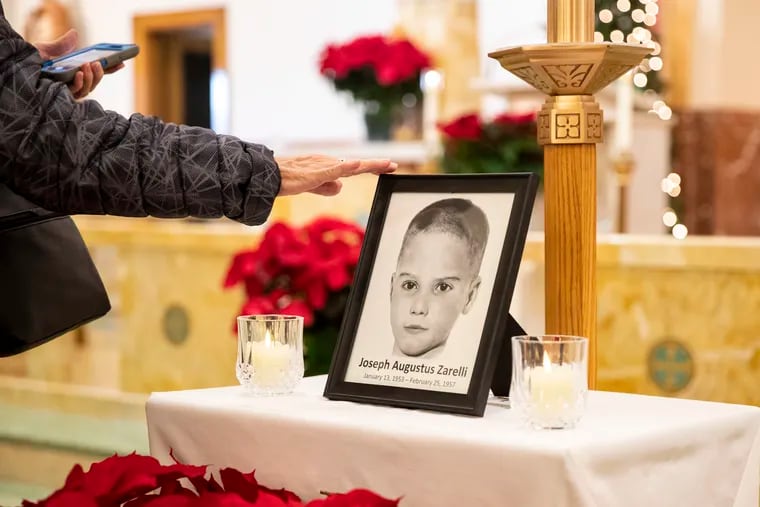 A photograph of Joseph Augustus Zarelli on display during Mass at St. Cecilia's Church on Wednesday. St. Cecilia Parish and Saint Timothy Parish, both located in Northeast Philadelphia, offered Masses on the Feast of the Holy Innocents for the happy repose of the soul of Joseph Augustus Zarelli.