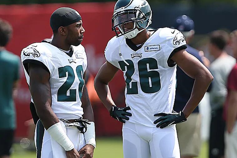 Eagles safety Earl Wolff and cornerback Cary Williams. (David Maialetti/Staff Photographer)