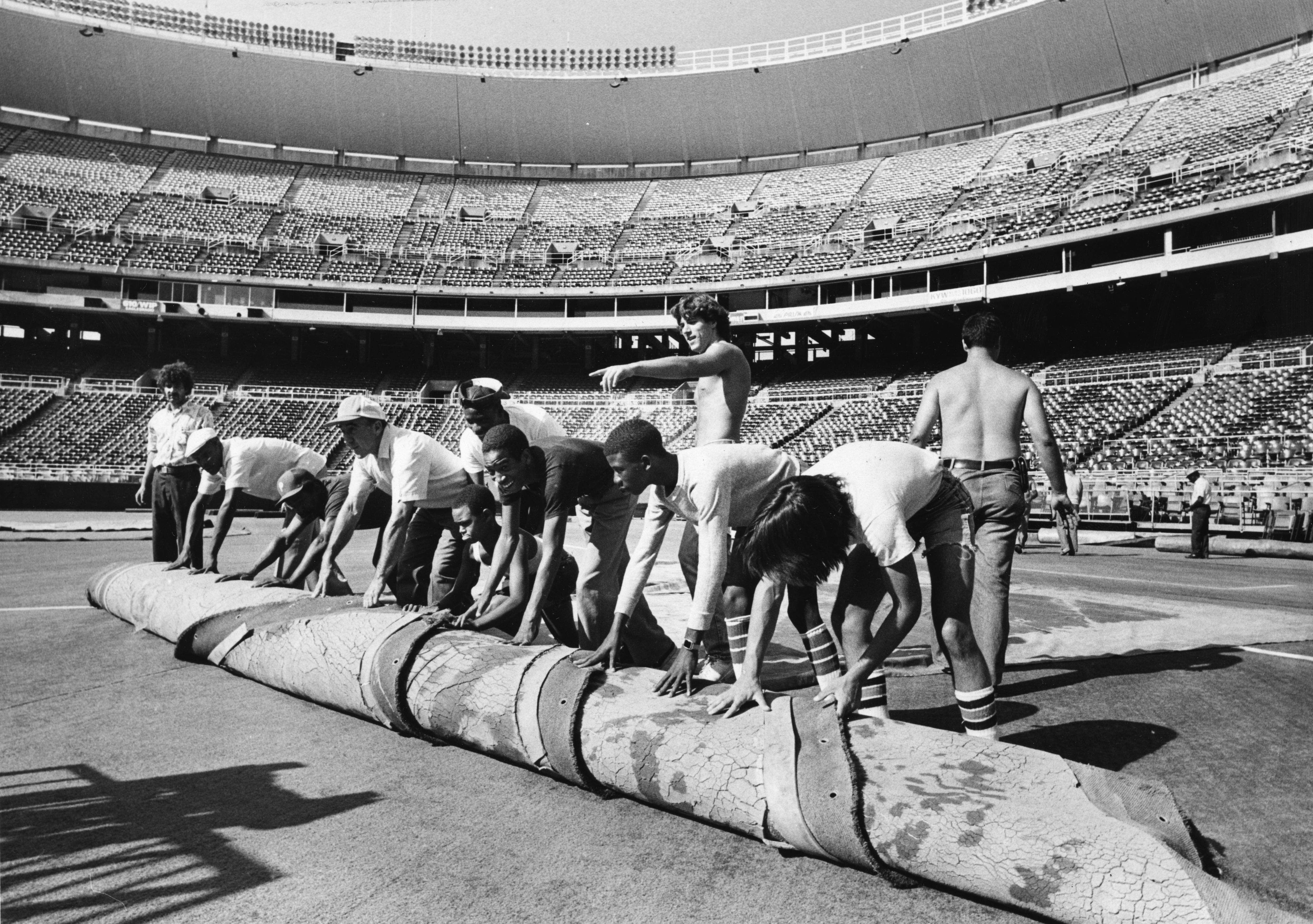 Former St. Louis Football Cardinals and Football Hall of Famer Larry  Wilson, pulls down his old number eight off of the rightfield wall at Busch  Stadium during a game between the Pittsburgh