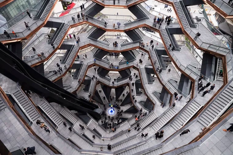 Visitors to Vessel climb its staircases on its opening day at Hudson Yards, Friday, March 15, 2019, in New York.