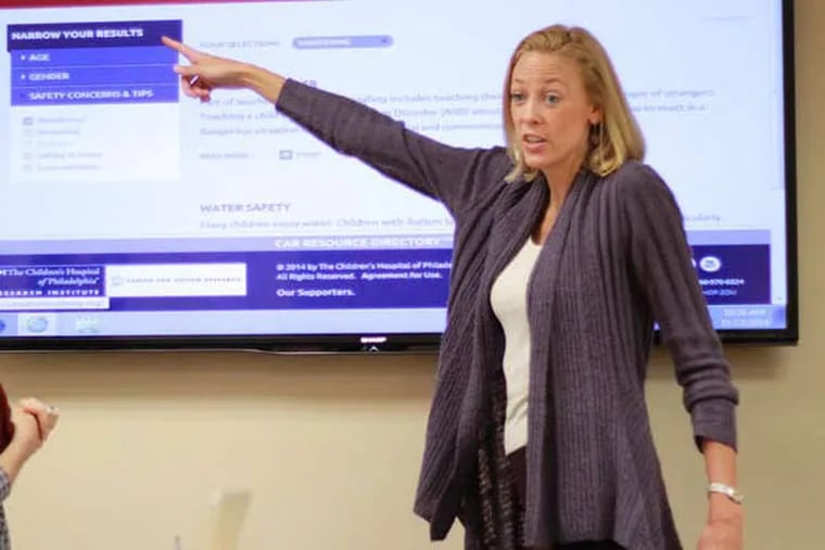 Debra Dunn (right), a consulting outreach director at the Center for Autism Research at Children's Hospital of Philadelphia, familiarizes clinicians with the Autism Roadmap website.