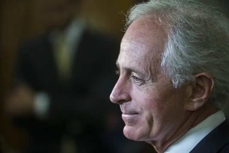 Sen. Bob Corker speaks with reporters outside his office after announcing he will not seek reelection.