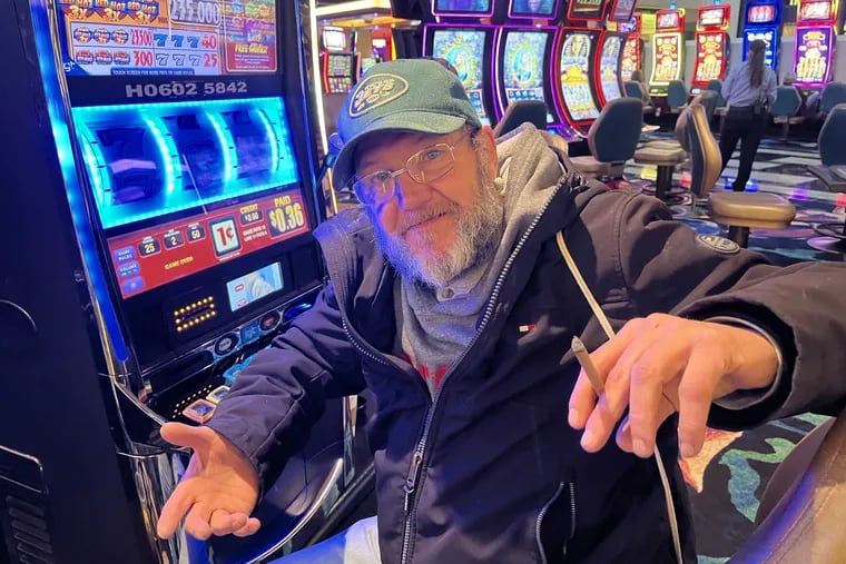 Bob Hafner, 56, of Long Beach Island, smoking an organic Cheyenne cigar at the slots inside Tropicana Hotel & Casino in Atlantic City on Sunday. A state senate committee is due to vote Monday on a total smoking ban inside Atlantic City's casinos.